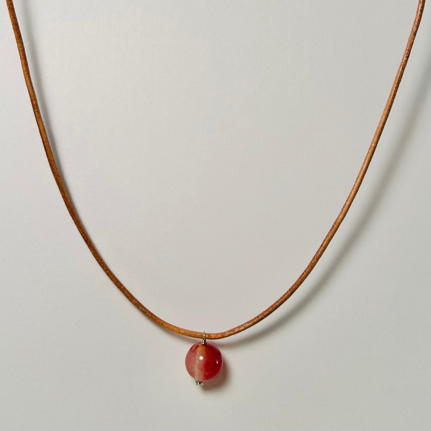 Handmade gemstone pendant necklace, adjustable, with hypoallergenic surgical steel.

Made with genuine leather cordage.