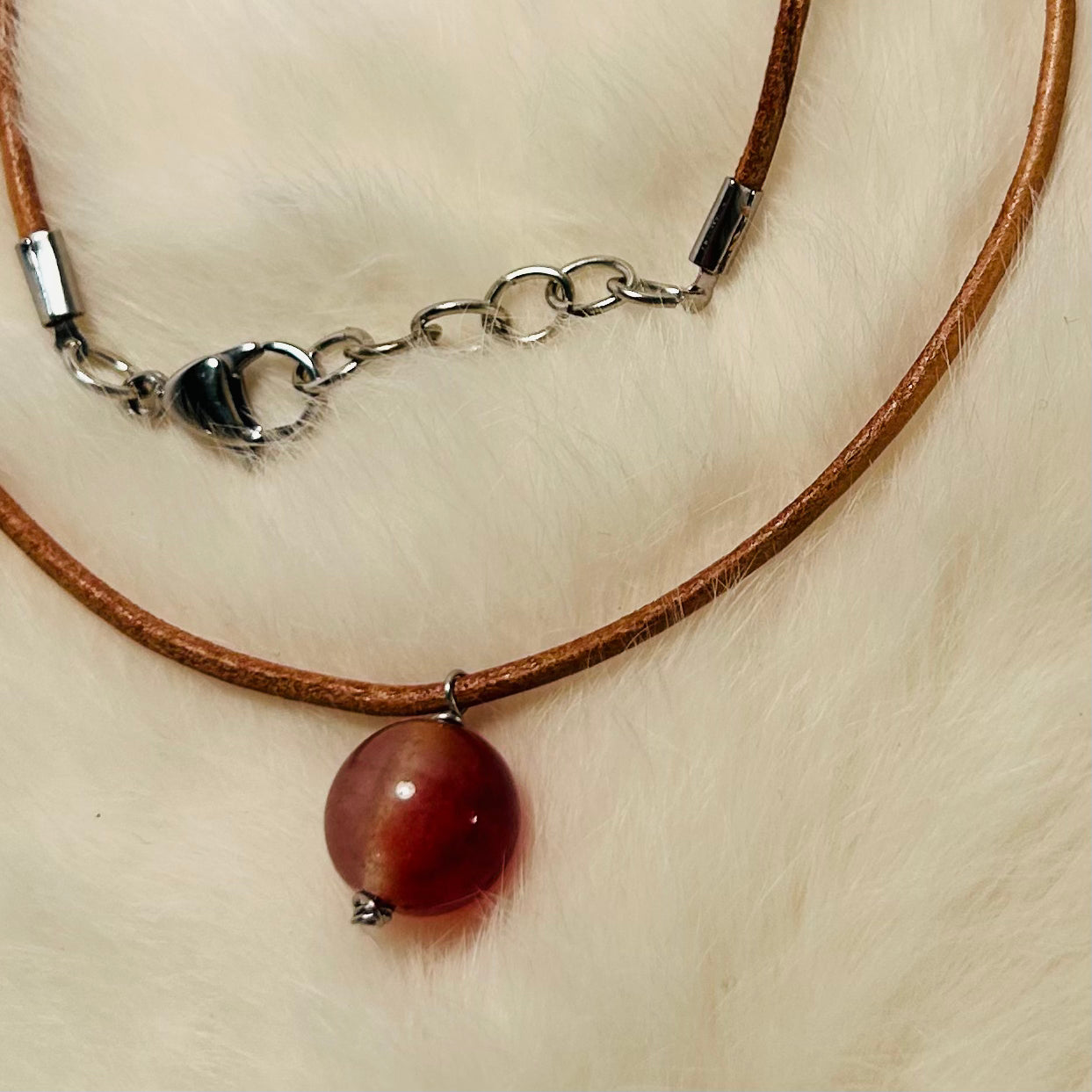 Handmade gemstone pendant necklace, adjustable, with hypoallergenic surgical steel.

Made with genuine leather cordage.