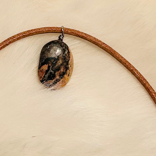 Handmade gemstone pendant necklace, adjustable, with hypoallergenic surgical steel.

Made with genuine leather cordage.

Featuring Jasper Gemstone.

Necklace can be worn at shortest length of 20.75 inches to longest length of 21.75 inches. 

Lobster Claw Clasp