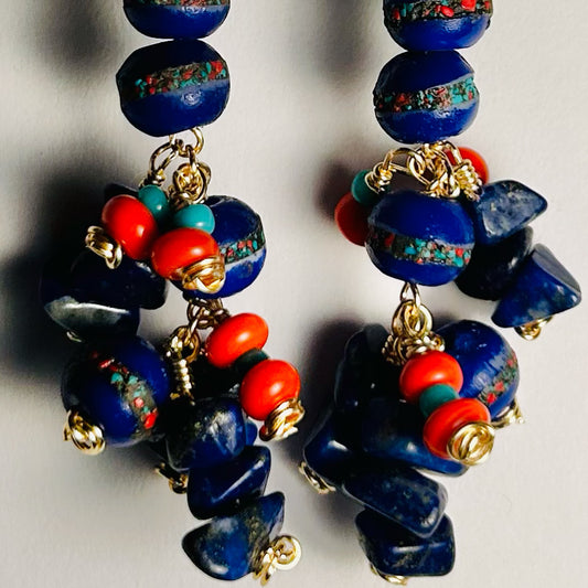 Handmade Pair of Beaded Earrings

 Surgical Steel Ear Wire, 2.5 inch long dangle

featuring Tibetan Hand Carved Cobalt Yak Bone Beads, Lapis Gemstone Chips, & Vintage Glass & Ceramic Beads upon Bare Copper Wire.