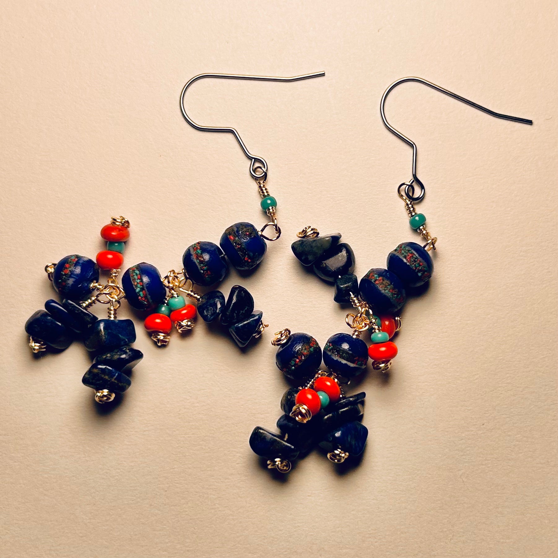 Handmade Pair of Beaded Earrings

 Surgical Steel Ear Wire, 2.5 inch long dangle

featuring Tibetan Hand Carved Cobalt Yak Bone Beads, Lapis Gemstone Chips, & Vintage Glass & Ceramic Beads upon Bare Copper Wire.