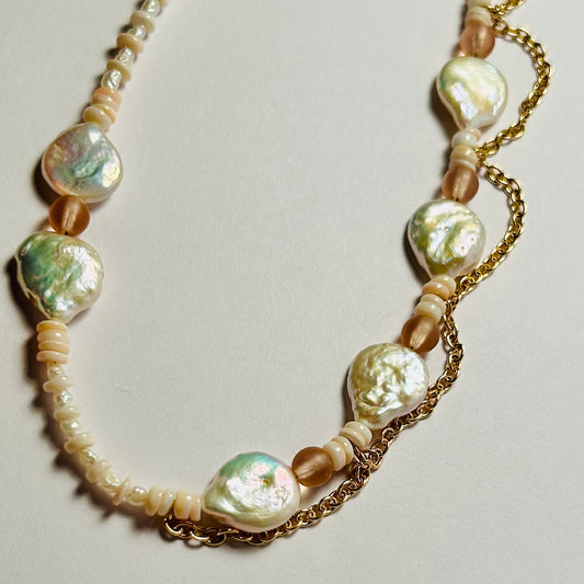 Handmade beaded necklace, adjustable length 18-18.5 inches 

Featuring vintage glass beads, coin pearls, up-cycled freshwater pearls, up-cycled shell, & up-cycled brass chain.

Spring Clasp Closure

Earth Angel