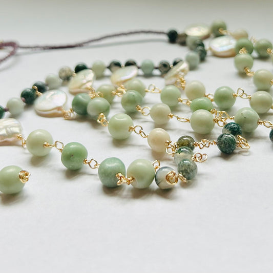Handmade beaded necklace, adjustable.

Featuring aventurine, moss agate, & green stone beads with new glass & genuine Pearl. 

Necklace can be worn at shortest length of 19 inches to longest length of 22.5 inches.

Hook & Eye Closure